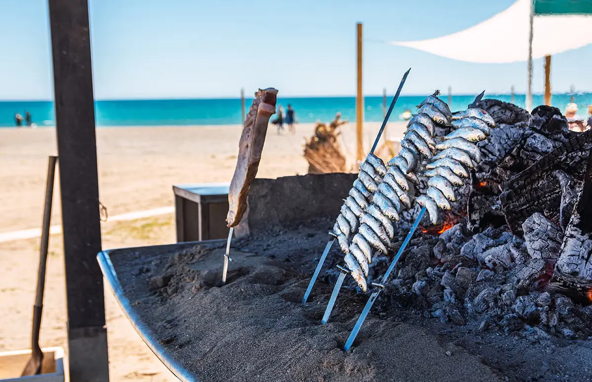 Espetos de sardinas on the shore